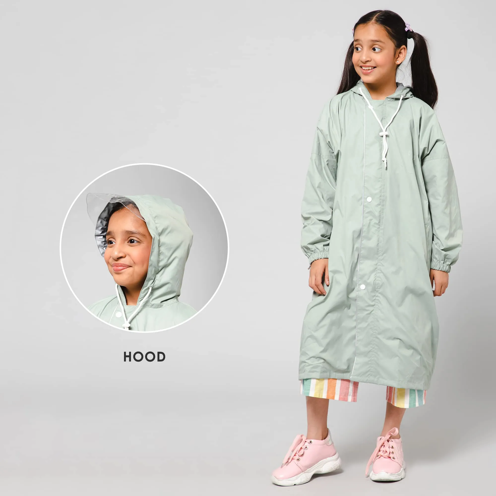 THE CLOWNFISH Cloud Chaser Series Kids Raincoat Waterproof Polyester Double Coating Reversible Longcoat with Hood and Reflector Logo at Back. Printed Plastic Pouch. Kid Age-7-8 years (Pista Green)