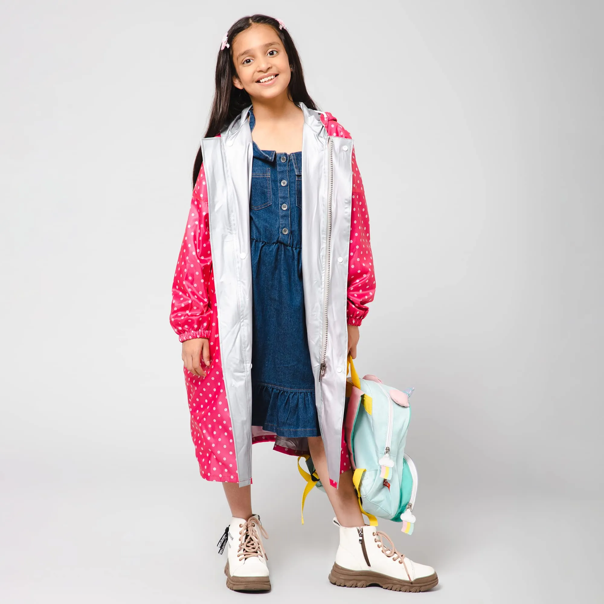 The Clownfish Drizzle Dot Series Kids Raincoat Waterproof Polyester Double Coating Reversible Longcoat with Hood and Reflector Logo at Back. Printed Plastic Pouch. Kid Age-11-12 years (Bubblegum Pink)